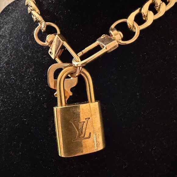 Louis Vuitton lock& key w 18 inch gold plated chainuse asNecklace/ bracelet
